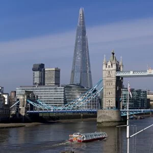 The Shard and Tower Bridge standing tall above the River Thames with RN flags in foreground, London, England, United Kingdom, Europe