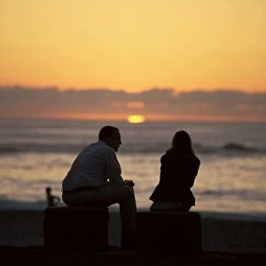 Silhouette of a couple watching the sunset