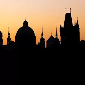 Silhouette of the old town buildings seen from Charles Bridge at sunrise, UNESCO World
