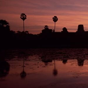 Silhouette and reflections of the temple of Angkor Wat at sunrise, UNESCO World Heritage Site