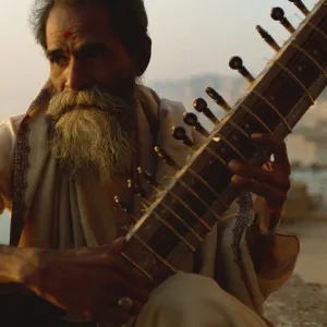 Sitar and player beside the Ganga River, Varanasi, Uttar Pradesh state, India, Asia