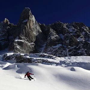 A skier enjoying perfect powder snow on the celebrated Pas de Chevre off-piste run