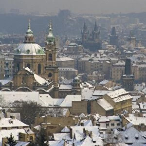 Skyline of the city of Prague in the winter, with snow on the roofs, Czech Republic
