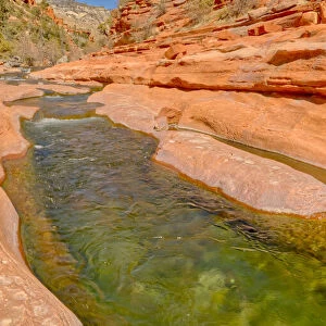 Slick rock water channel in Slide Rock State Park where most swimmers begin their slide