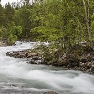 Slow motion blur detail of a raging river in Hellmebotyn, Tysfjord, Norway, Scandinavia, Europe