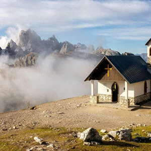 Small church with the Cadini di Misurina mountain range in the background, Dolomites