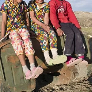 Three smiling girls posing for the camera, Murgab, Tajikistan, Central Asia, Asia