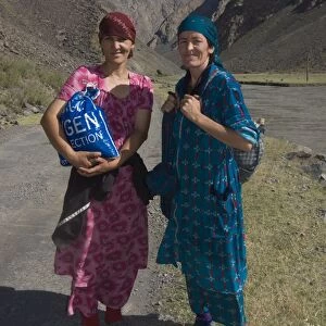 Two smiling women going for a walk in Bartang Valley, Tajikistan, Central Asia, Asia