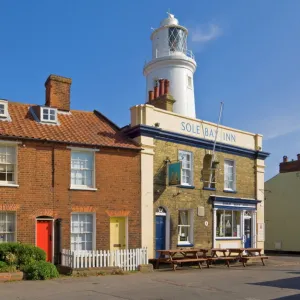 The Sole Bay Inn pub with Southwold lighthouse behind, Southwold, Suffolk