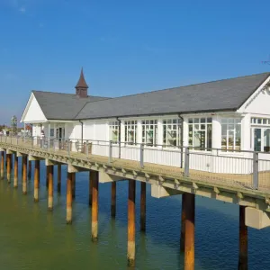 Southwold pier looking back towards the shore in the early afternoon sunshine