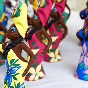 Souvenir traditional Cuban lady statues for sale in craft market in Trinidad