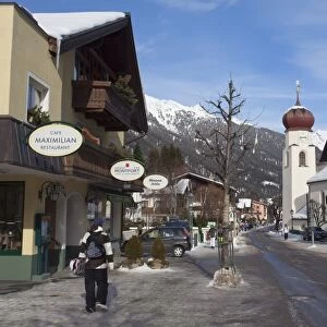 St. Anton am Arlberg main road and church in winter snow, Tyrol, Austrian Alps