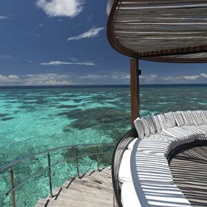 Stairs to the beach and sofa overlooking the ocean, Maldives, Indian Ocean, Asia