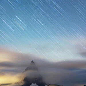 Star trail in the night sky on Matterhorn from observatory tower of Kulmhotel Gornergrat