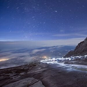 Stars and torch lights illuminating hiking trail, Kinabalu National Park (4095m)