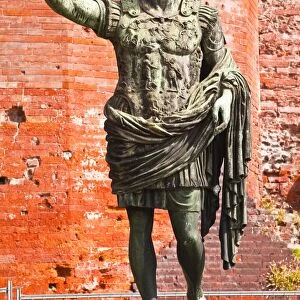 A statue of Caesar Augustus in front of Porta Palatina, Turin, Piedmont, Italy, Europe