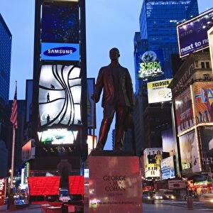 Statue of George M. Cohan, composer of Give My Regards to Broadway, Times Square at dusk