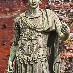 A statue of Julius Cesar in front of Porta Palatina, Turin, Piedmont, Italy, Europe