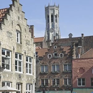Stepped Flemish gables over street cafes with the Belfry by the Market Square behind, Brugge, UNESCO World Heritage Site, Belgium, Europe