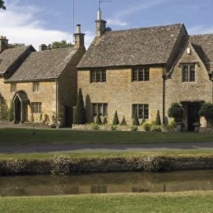 Stone cottages along the banks of the River Eye, Lower Slaughter, The Cotswolds
