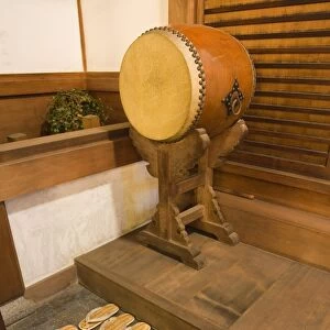 Straw sandals and drum at temple