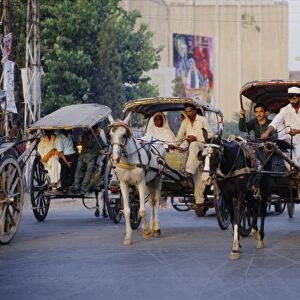 Street scene with horse drawn carriages