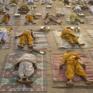 Students of a Sanskrit school performing the savasana (corpse