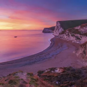 A stunning sunset over Durdle Door on the Jurassic Coast, UNESCO World Heritage Site