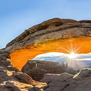 The sun rising under Mesa Arch, Canyonlands National Park, Moab, Utah, United States of America
