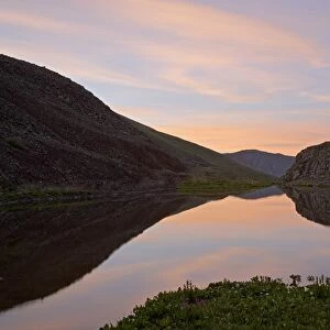 Sunrise reflection in a pond downstream of Clear Lake, San Juan National Forest