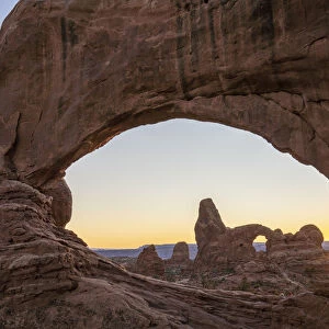 Sunset and Turret Arch view through Windows Arch, Arches National Park, Utah