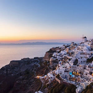 Sunset view of buildings overlooking sea, Oia, Santorini, Cyclades, Greek Islands, Greece, Europe