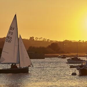A sunset view of sailing on the River Exe at Topsham, near Exeter, Devon, England