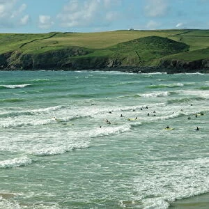 Surfers at Polzeath, Hayle Bay and the Cornish coast, Cornwall, England