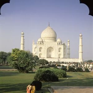 The Taj Mahal through ornate archway