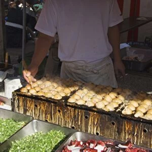 Takoyaki octopus balls being made at monthly flea market