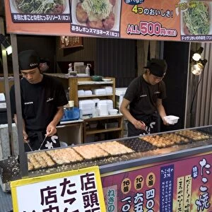 Takoyaki (octopus balls) stand in Dotonbori entertainment district of Namba