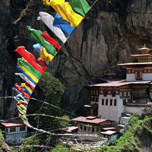 Taktshang Goemba (Tigers nest monastery) with prayer flags and cliff, Paro Valley, Bhutan, Asia