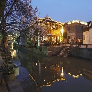 Teahouse at dusk along canal, Suzhou, Jiangsu, China, Asia