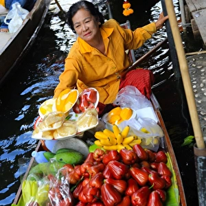 Thai woman selling fruit at floating market, Bangkok, Thailand, Southeast Asia, Asia