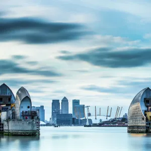 Thames Barrier on River Thames and Canary Wharf in the background, London, England