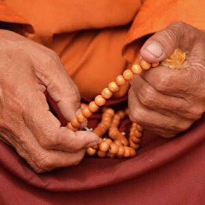 Tibetan monk holding prayer beads, Nepal, Asia