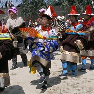 Tibetans dressed for religious shamans ceremony, Tongren, Qinghai Province