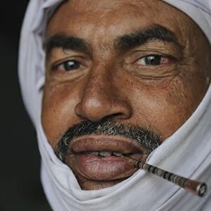 Touareg smoking a traditional cigarette, Nouadhibou, Mauritania, West Africa, Africa
