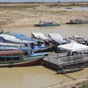 Tour boats docked at a jetty, Tonle Sap, Cambodia, Indochina, Southeast Asia, Asia