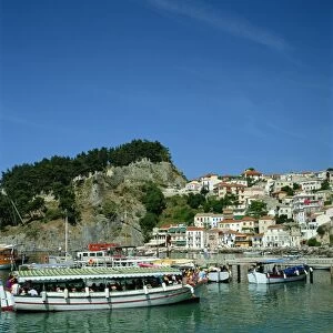 Tourist boats and the town of Parga in the background