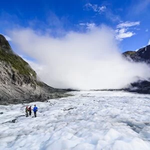 Tourist hiking on Fox Glacier, Westland Tai Poutini National Park, South Island, New Zealand, Pacific