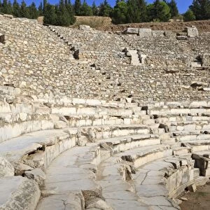 Tourist sits in the Odeon, Bouleuterion (small theatre), ancient Ephesus, near Kusadasi, Anatolia, Turkey, Asia Minor, Eurasia