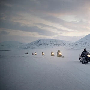 Tourists on snowmobiles (skidoos) near Barentsburg, Svalbard, Arctic, Norway, Scandinavia, Europe