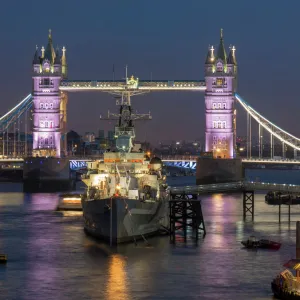 Tower Bridge and HMS Belfast on the River Thames at dusk, London, England, United Kingdom